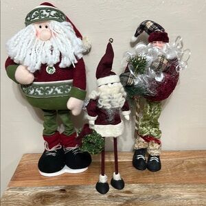 (3) Santas standing tall for Christmas in red and white